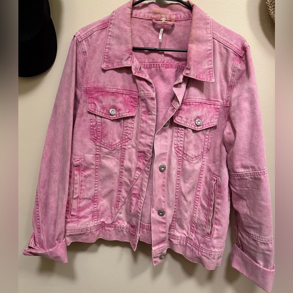 Free People denim jacket in washed pink, size XL.